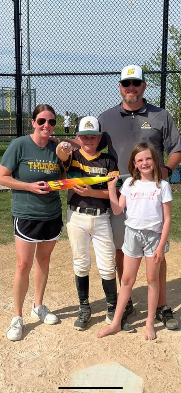 Chris Engel with his family at a baseball field