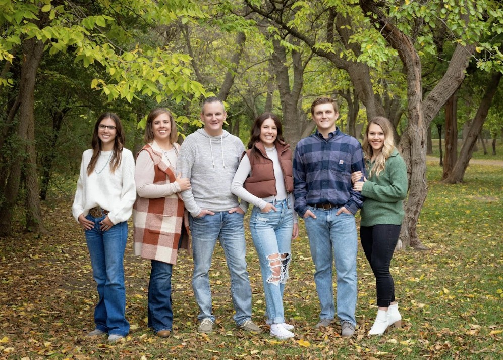 Kenny Blair with his family outdoors